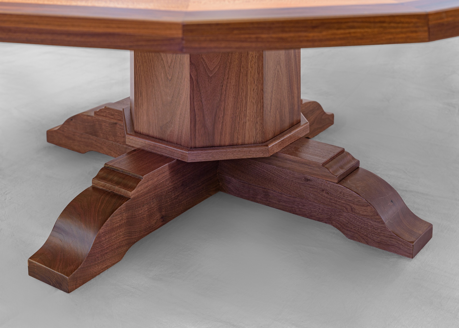 Walnut pedestal base with sculpted feet